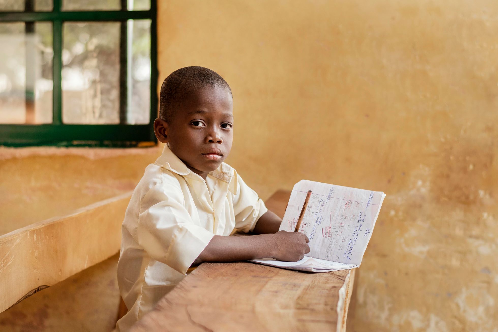 African kid learning class