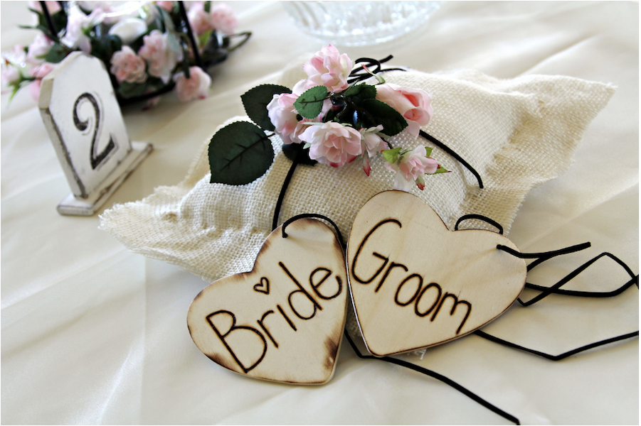 wooden hearts of groom and bride