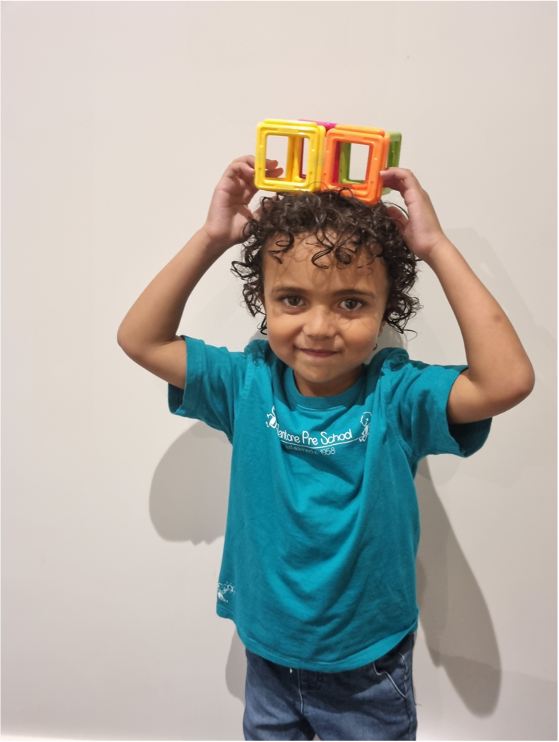 Mentone Kinder Preschool Child with Toys on Head