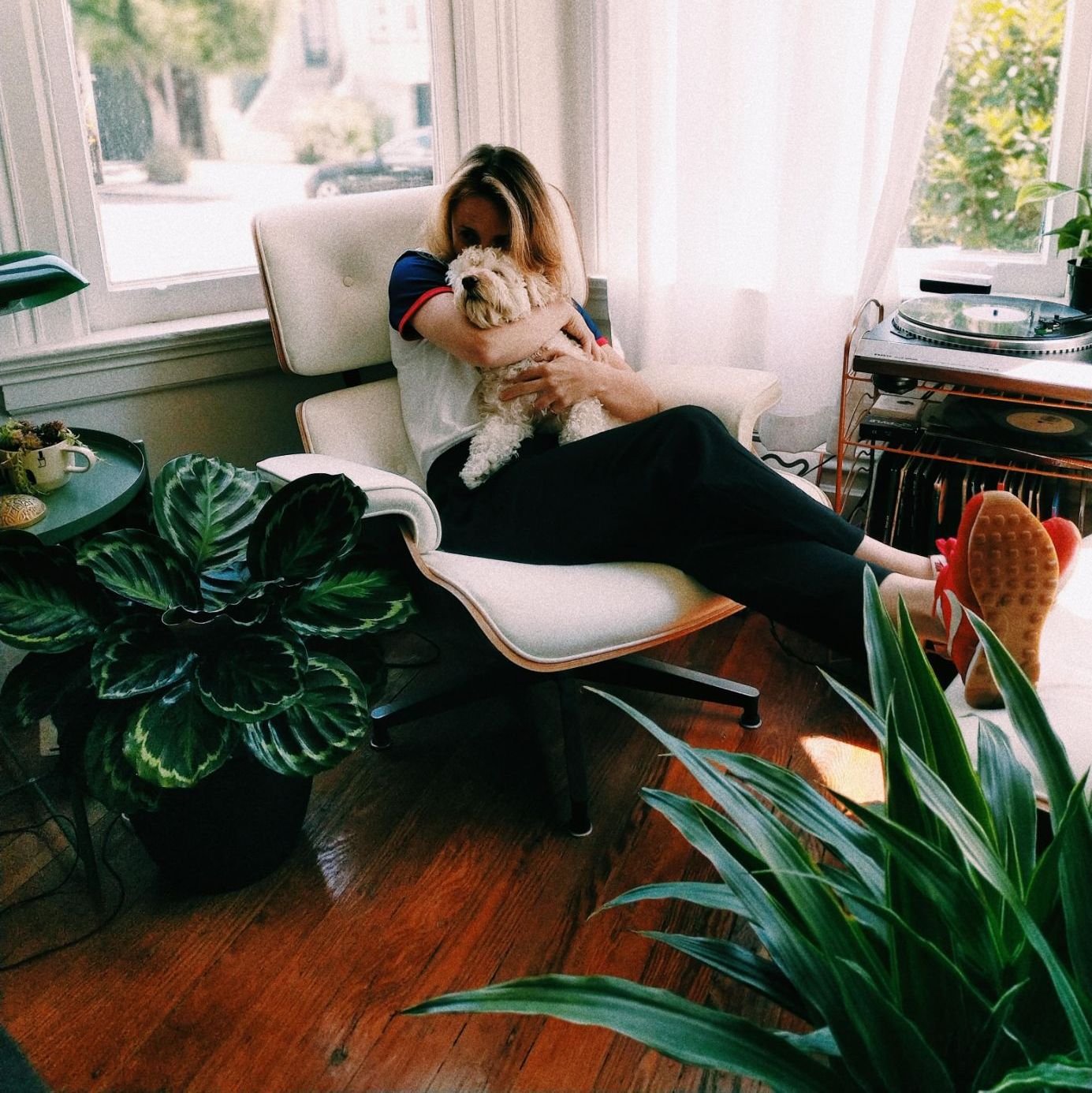 woman relaxing at home with dog